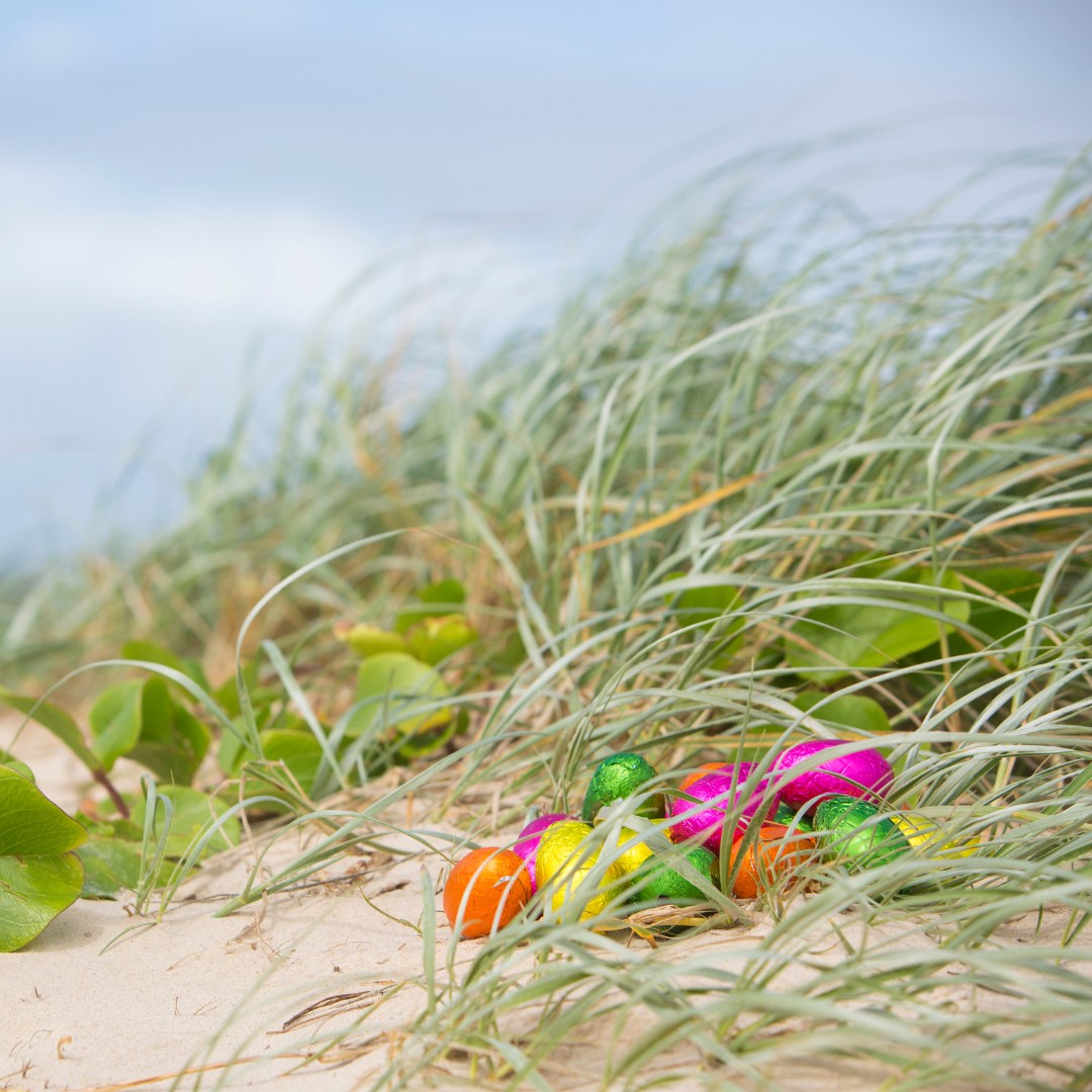 easter eggs in the sand at the beach